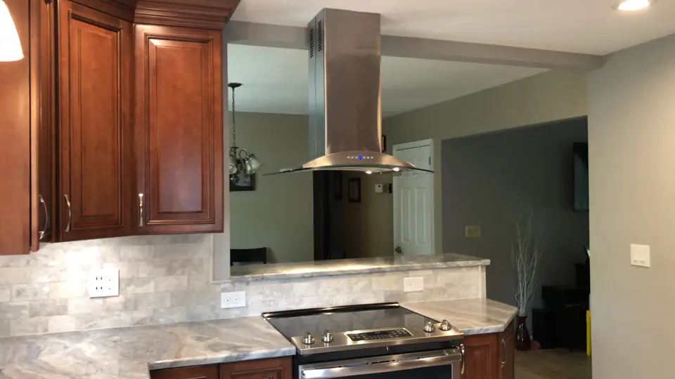 Island range with a chimney hood